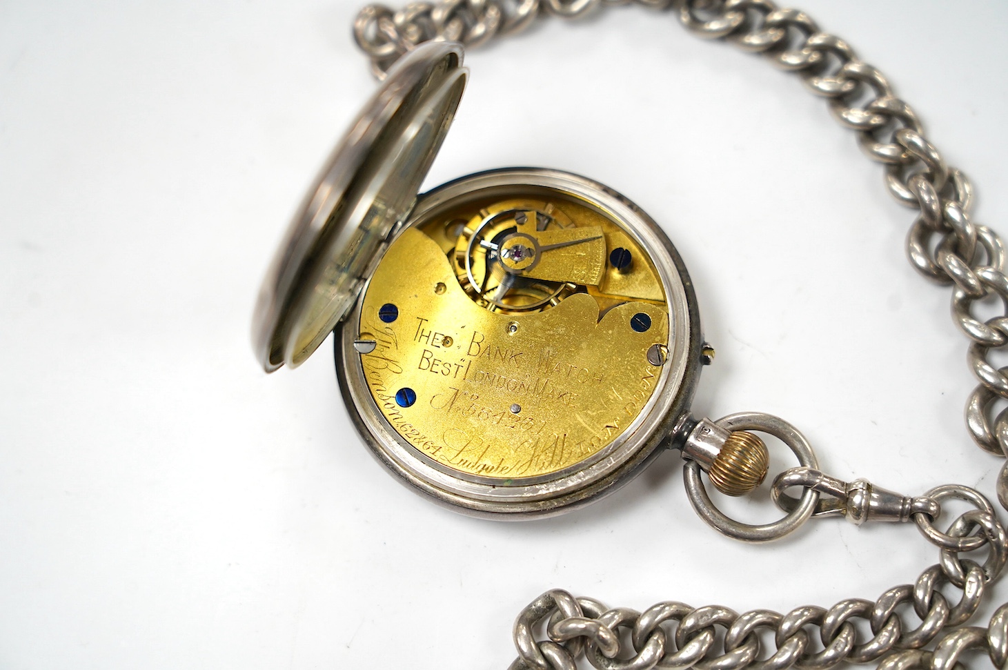 A late Victorian silver open face pocket watch, by J.W. Benson, with Roman dial and subsidiary seconds, together with a silver albert. Condition - poor to fair